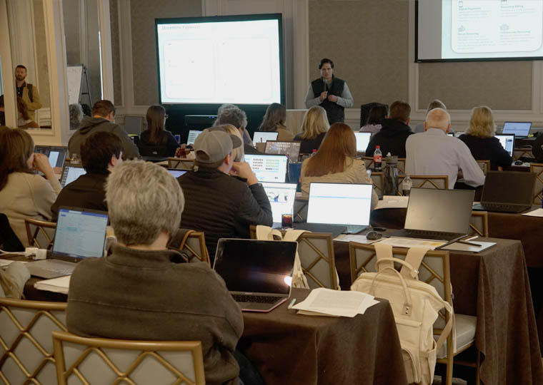 Learning Zone A class of professional employees as students looking at the front of the class